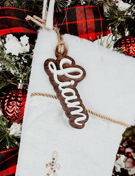 personalized name tag for christmas stocking, custom wood name cut out for kids xmas ornament, wooden name cut out on top of wood backer stained dark, light top