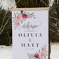 custom welcome to our wedding sign, ceremony entrance, reception entrance wedding decor, personalized with welcome message, couples names and date of venue, accented with floral designs in the corners, sign has wood top & bottom, it is made from canvas, it hangs freely with a rope on top.