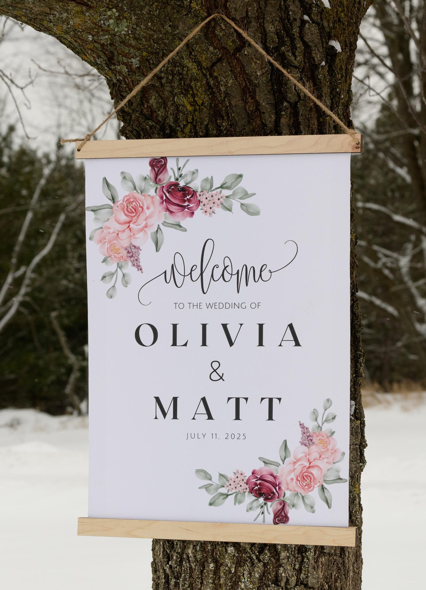 custom welcome to our wedding sign, ceremony entrance, reception entrance wedding decor, personalized with welcome message, couples names and date of venue, accented with floral designs in the corners, sign has wood top & bottom, it is made from canvas, it hangs freely with a rope on top.