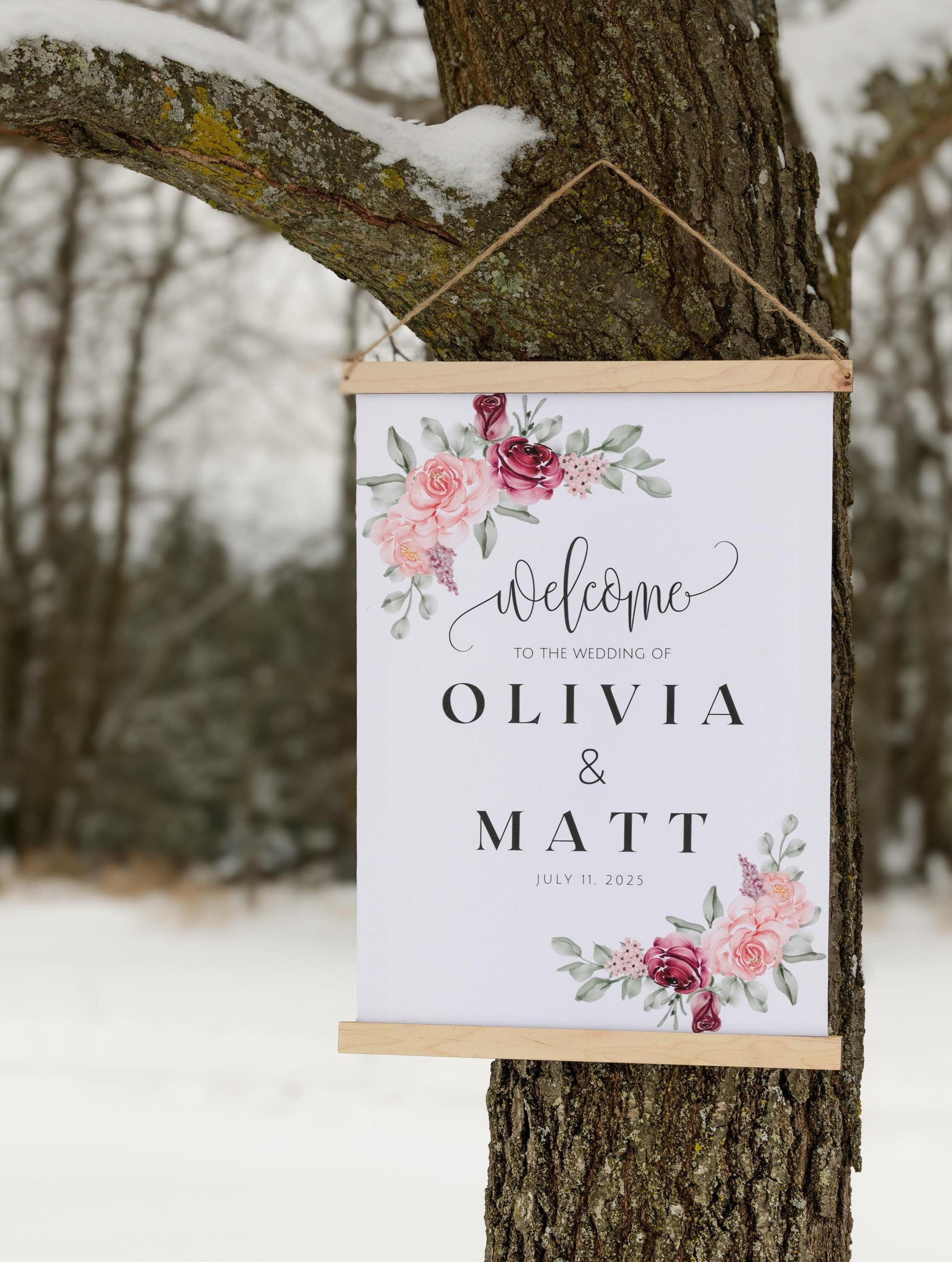 custom welcome to our wedding sign, ceremony entrance, reception entrance wedding decor, personalized with welcome message, couples names and date of venue, accented with floral designs in the corners, sign has wood top & bottom, it is made from canvas, it hangs freely with a rope on top.