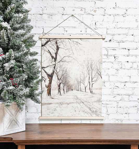 winter scene, snowy, snow draped trees, horse carriage down street, painting on canvas print, hanging from rope, wood frame on top and bottom, floating easy to hang, lightweight sign
